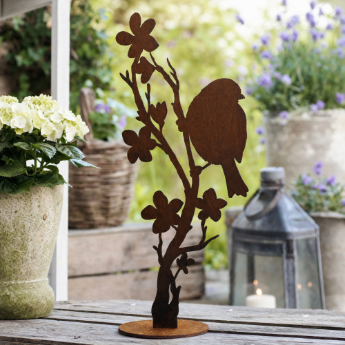 Danas järnfigur - Fågel på blomstergren